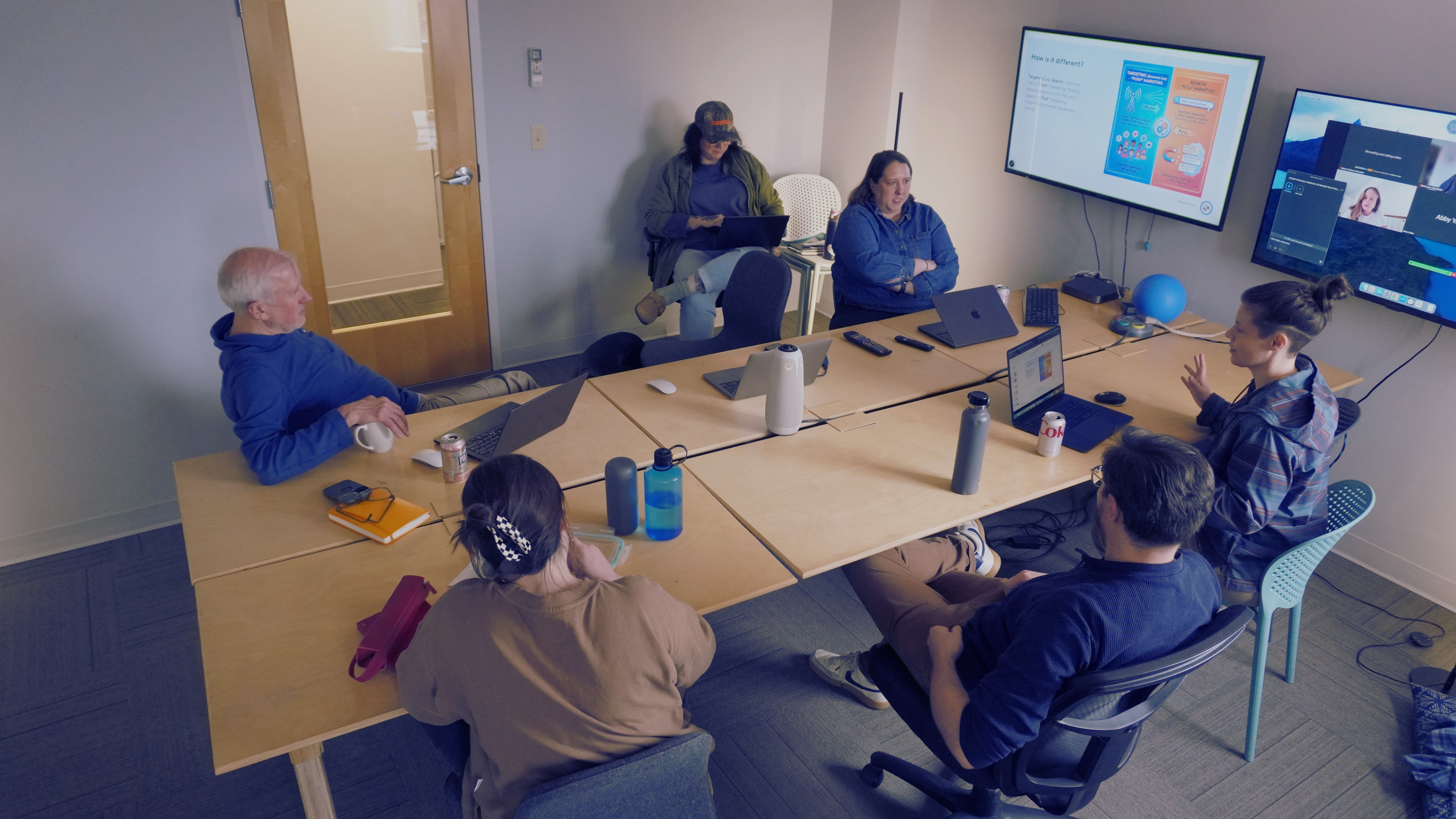 Members of the Energy Circle team sat around a table discussing client project strategy