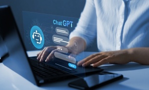 projection of computer screen showing robot and word 'ChatGPT'