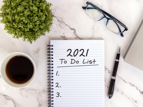 2021 to do list on desk flat lay with glasses coffee and plant