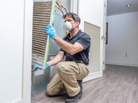 hvac contractor with mask and gloves 